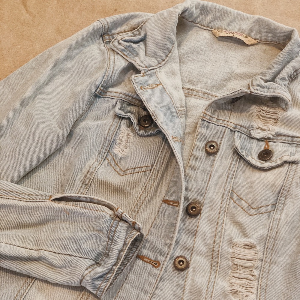 Jean jacket with holes